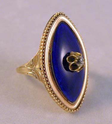 A LADIES 14K YELLOW GOLD ENAMELED AND DIAMOND RING: A LADIES 14K YELLOW GOLD ENAMELED AND DIAMOND RING with blue guilloche enamel and central diamond approx. .18ct and monogrammed insigna on inside, circa 1920 with fine beadwork border 1 ¼"w