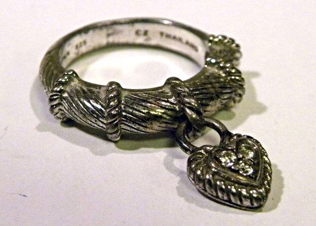 Judith Ripka ring: S.S. ring w/ hanging heart charm having 3 cz's. ring is size 6. weight is 5.8g