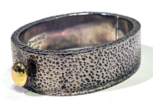 Pat Areias Sterling & 18k Bangle Bracelet: Sterling silver & 18K Hammered Texture Bangle made by designer Pat Areias. Width Approx 3/4" 67.3 Grams