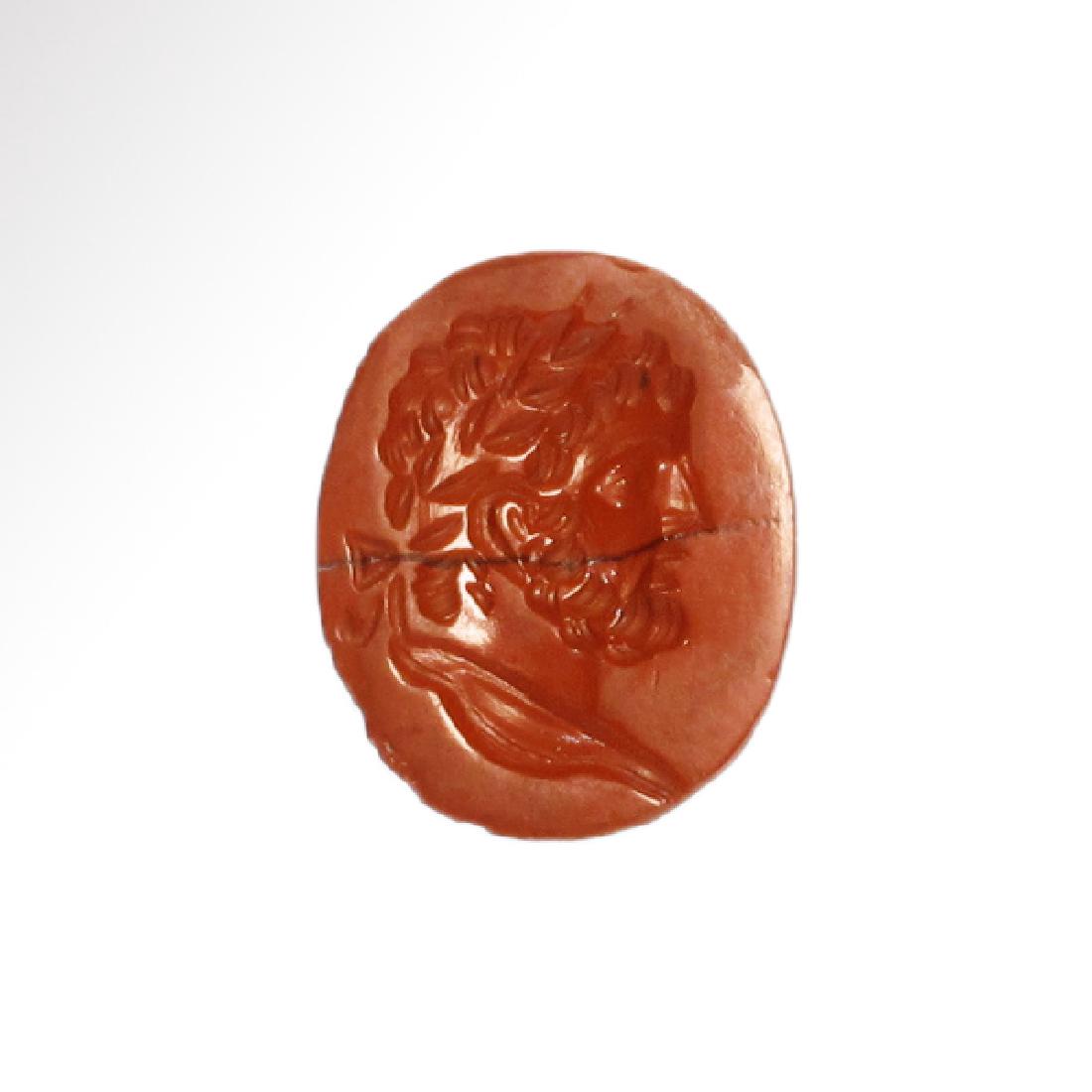 Roman Red Jasper Intaglio with Head of Emperor: Roman Red Jasper Intaglio with Head of Emperor Caracalla, c. 200-217 A.D. Of red jasper with a natural thin black band. Engraved with the profile bust of Emperor Caracalla wearing a diadem. Size:1.4 c