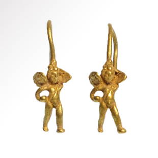 Pair of Roman Gold Earrings With Eros, 1st Century A.D.: Pair of Roman Gold Earrings With Eros, c. 1st Century A.D.Two figures of winged Eros (Cupid) with spread wings, holding a ball in their right hands, each attached to a hoop.Size:2.5 cm L - 1 inch each