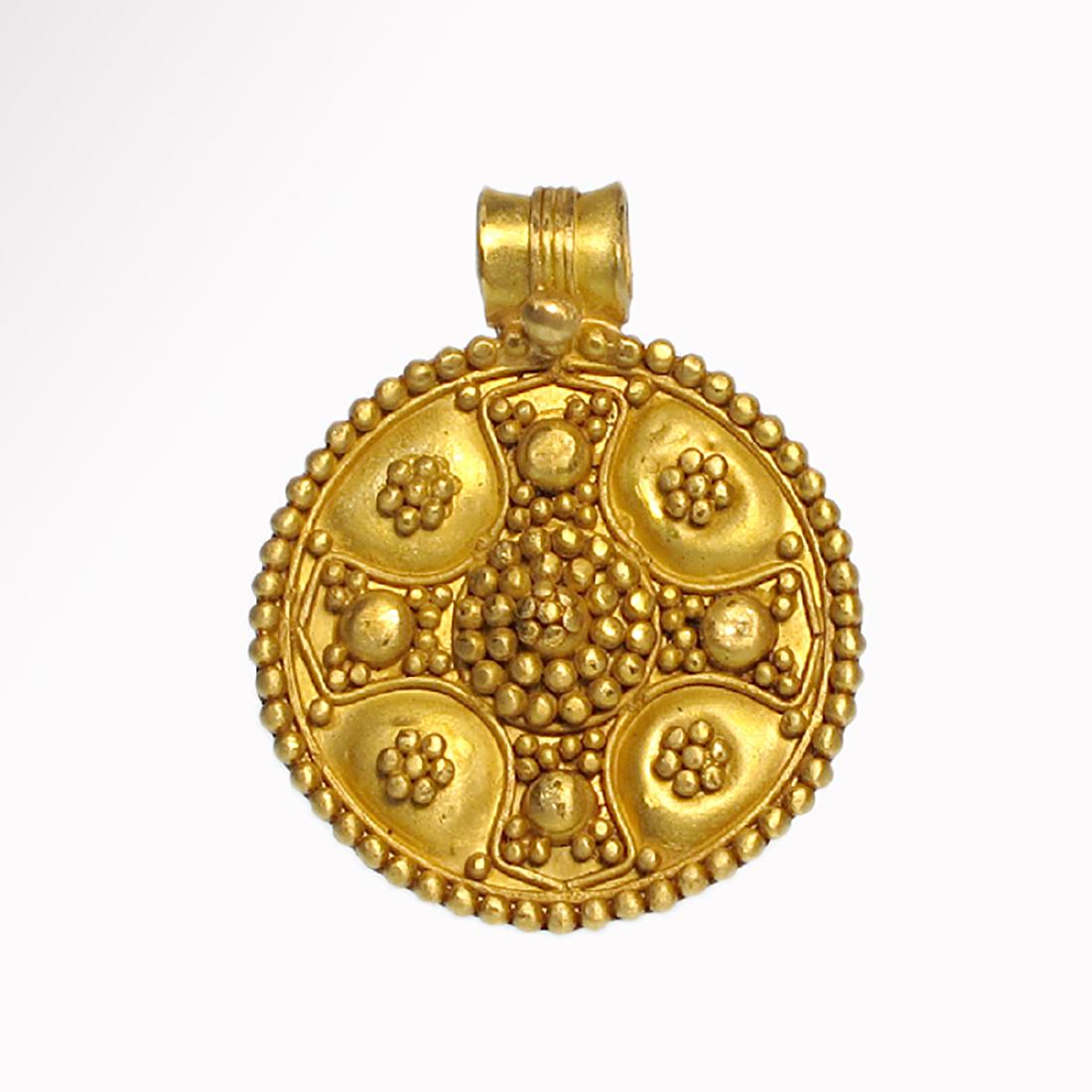 Byzantine Gold Cross Pendant, c. 8th-10th Century A.D.: Byzantine Gold Cross Pendant, c. 8th-10th Century A.D. The round plate decorated with fine granules forming a cross in the centre framed by a band of granules, wide suspension loop. Size:3.9 cm L - 1 