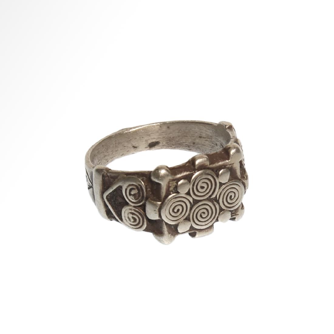 Viking Silver Ring with Spiral Patterns, c. 10th: Viking Silver Ring with Spiral Patterns, c. 10th Century A.D. The top and sides decorated with wire spirals. Size:USA = 8 3/4 , GB= R, 1.9 cm (inside D) Material:Silver, 7.6 grms Culture:Viking, c. 10