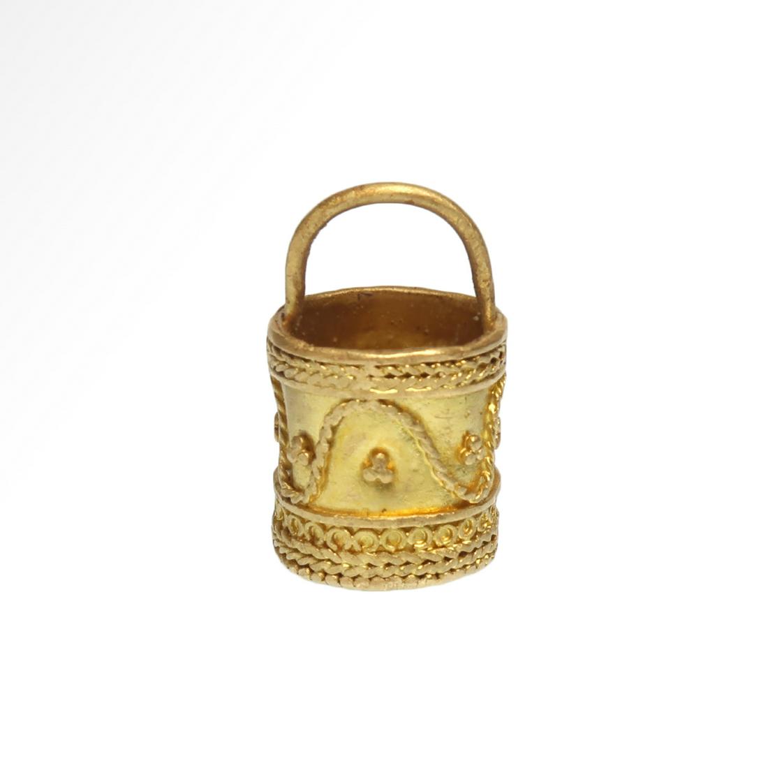 Viking Solid Gold Situla / Bucket Pendant, c. 9th-11th: Viking Solid Gold Situla / Bucket Pendant, c. 9th-11th Century A.D. Decorated with filigree bands of rope, granules and circles. Size:2.5 cm L (including loop) - 1 inch Material:Gold, 7.5 grms Culture