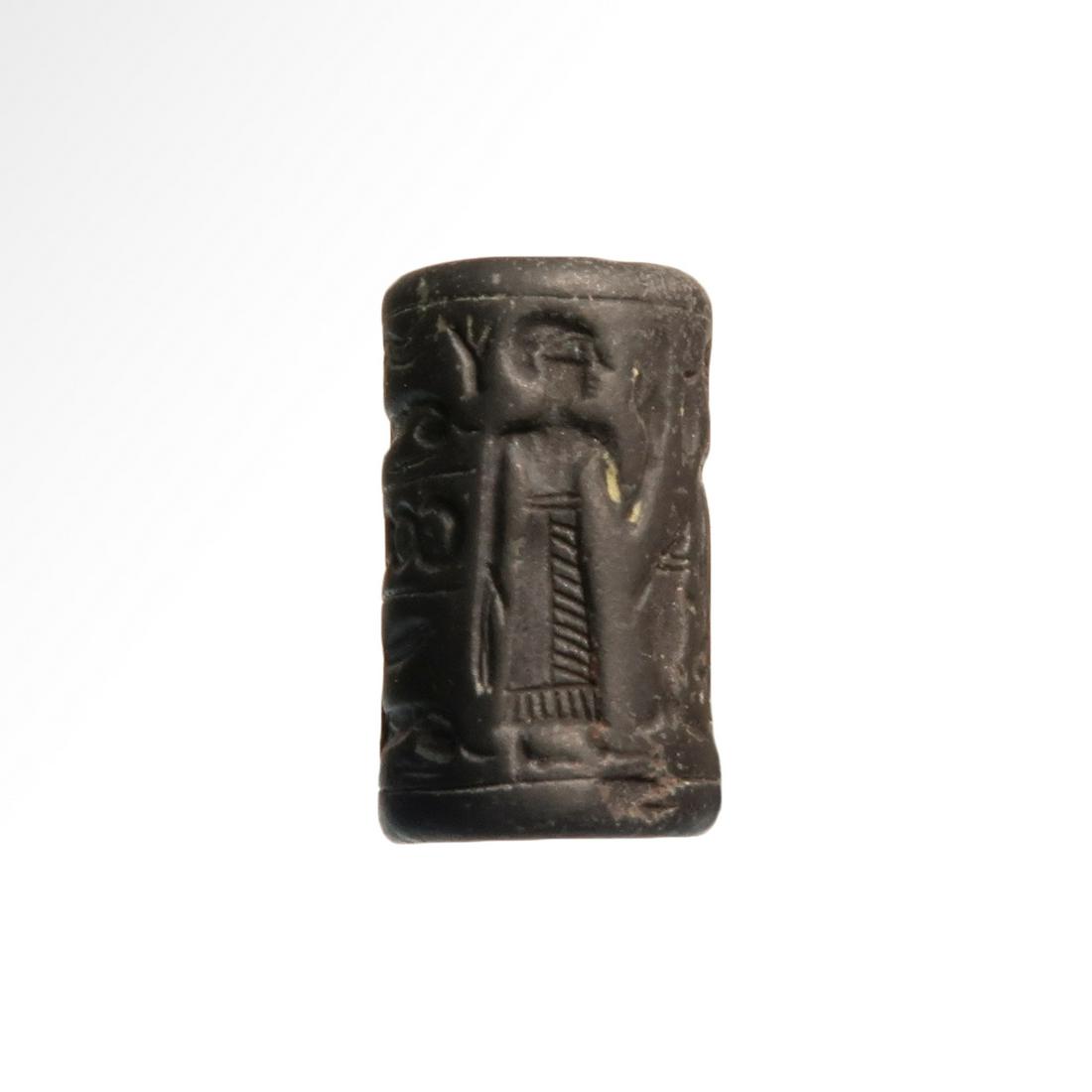 Hematite Cylinder Seal with Worship Scene, Syria, c.: Hematite Cylinder Seal with Worship Scene, Syria, c. 1800 - 1500 B.C.Nicely carved with worship scene of three figures, guilloche with animal above and below. Comes with description and dating by Pro