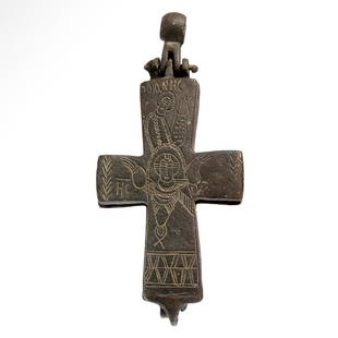 Byzantine Bronze Reliquary Cross Pendant with Saints and Jesus, c. 10th - 12th century A.D.: Byzantine Bronze Reliquary Cross Pendant with Saints and Jesus, c. 10th - 12th century A.D.Bronze enkolpion reliquary cross pendant comprising two hinged plates and an articulated suspension loop