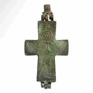 Byzantine Bronze Reliquary Cross Pendant with Saint and Jesus, c. 10th - 12th century A.D.: Byzantine Bronze Reliquary Cross Pendant with Saint and Jesus, c. 10th - 12th century A.D.Bronze enkolpion reliquary cross pendant comprising two hinged plates and an articulated suspension loop with