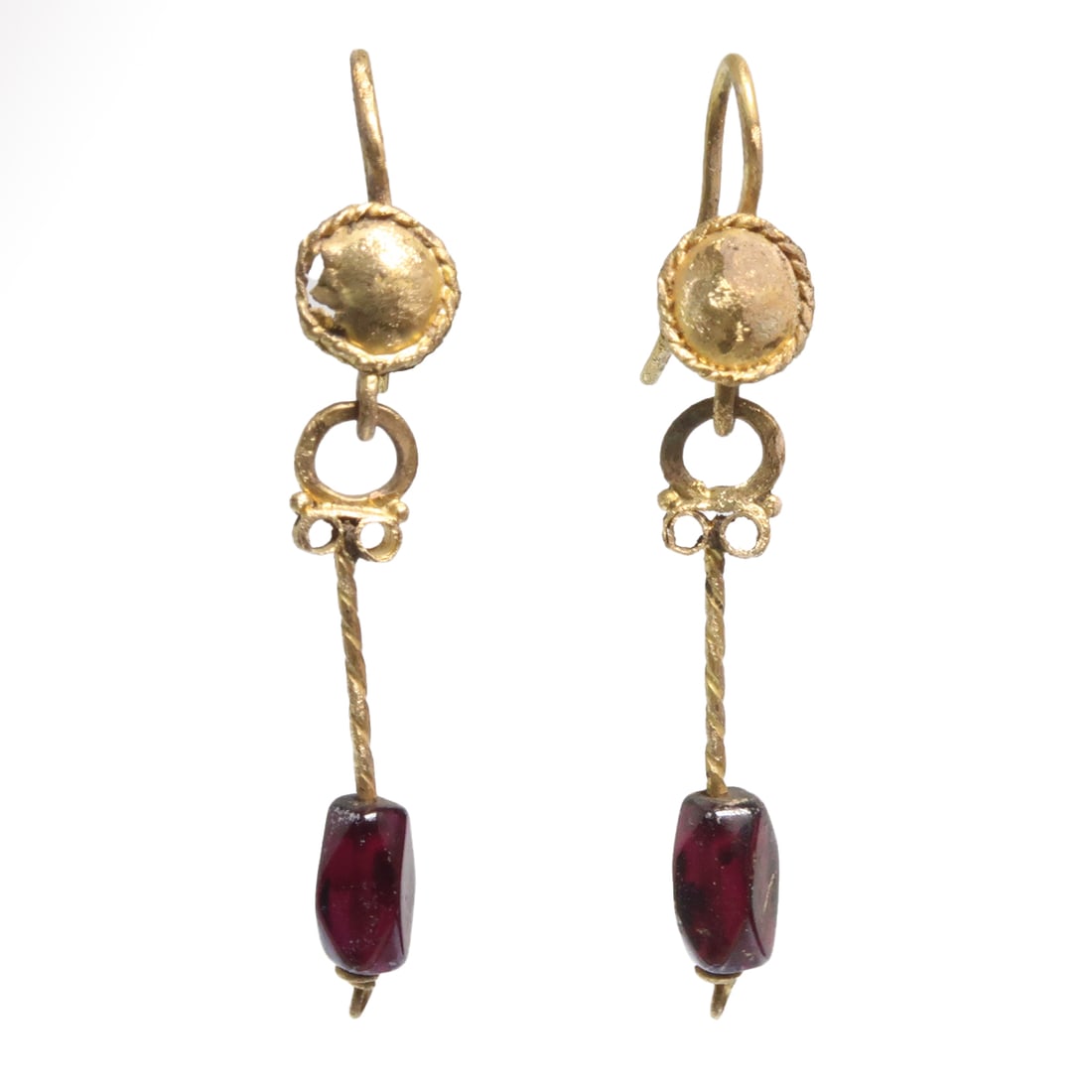 Roman Gold and Garnet Earrings, c. 2nd-3rd Century A.D.: Roman Gold and Garnet Earrings, c. 2nd-3rd Century A.D. Comprising a shield plate with hook behind and a string pendant decorated with a scroll and granules on top terminating with a faceted garnet. E