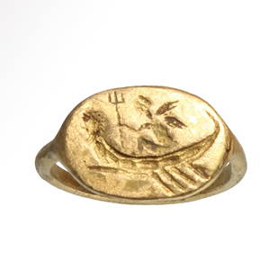 Roman Solid Gold Ring with Eros on Neptune's Boat, c. 1st-2nd Century A.D.: Roman Solid Gold Ring with Eros on Neptune's Boat, c. 1st-2nd Century A.D.Engraved with a boat with Neptune head, with seated Eros holding the trident.Size:USA= 6 1/2 - GB= M/N - 1.8 cm inside D