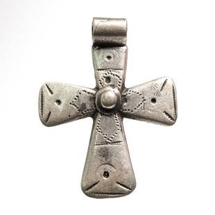 Viking Silver Cross with Punched and Engraved Decoration, c. 11th Century A.D.: Viking Silver Cross with Punched and Engraved Decoration, c. 11th Century A.D.Decorated with typical punched concentric marks, dots and fine lines, and a central silver knob. Wide suspension