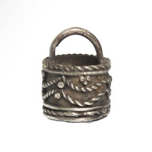 Viking Silver Scent Bucket Pendant, c. 11th Century A.D.: Viking Silver Scent Bucket Pendant, c. 11th Century A.D.Of perfect basket shape, decorated with fine rope patterns and granules, one handle doubling as suspension loop.Size:2 cm L (including loop) - 3