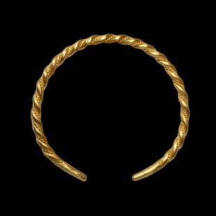 Viking Gold Bracelet, c. 9th Century A.D.: Viking Gold Bracelet, c. 9th Century A.D.Made of double thick gold wires, twisted together with a rope patterned wire in between, all wires merging together into plain gold terminals.Size:6.4 cm insid