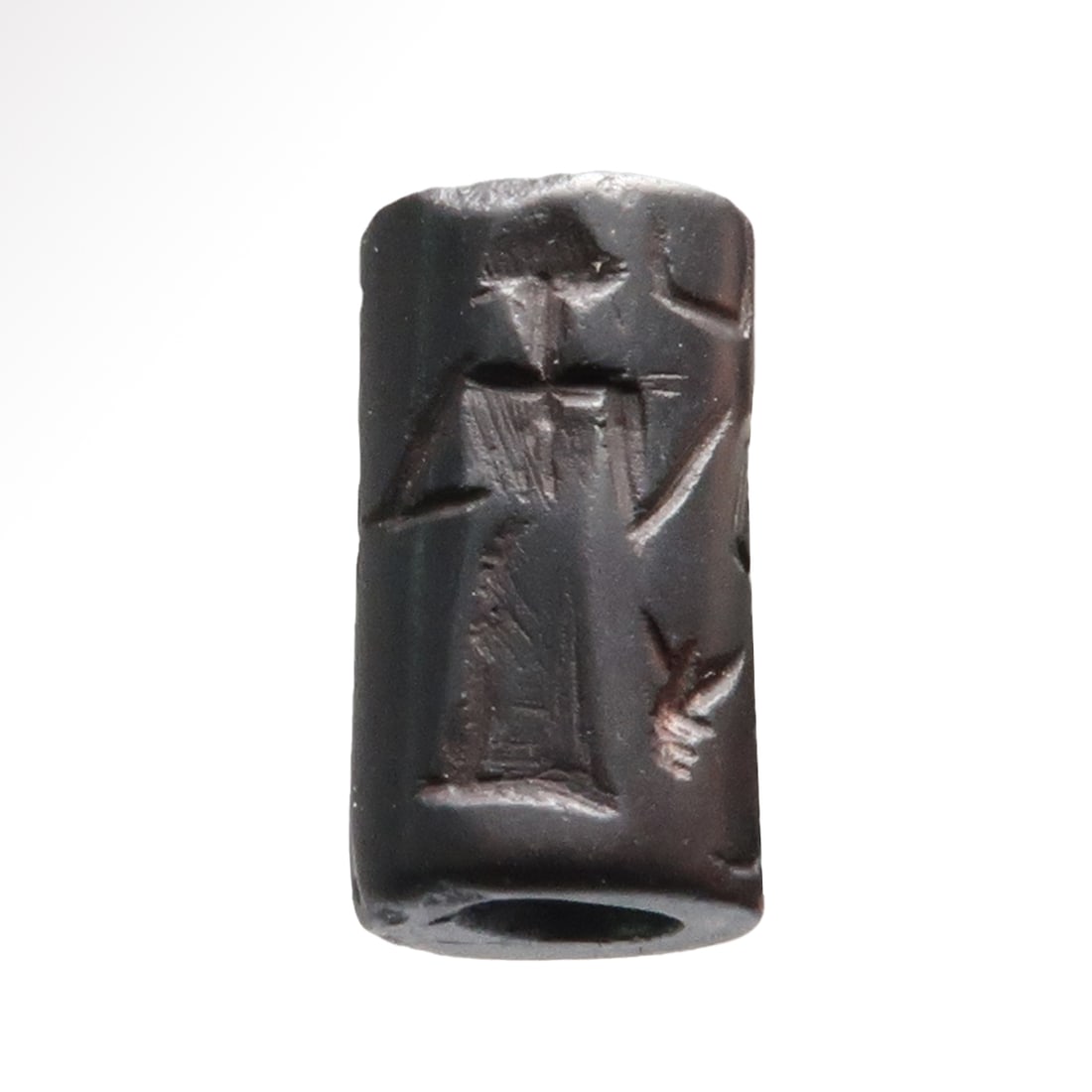 Old Babylonian Hematite Cylinder Seal with God Nanna, c. 1900- 1700 B.C.: Old Babylonian Hematite Cylinder Seal with God Nanna, c. 1900- 1700 B.C.Showing a central standing god, probably Nanna, the moon god, a crescent in the sky, two figures standing on either side and a s