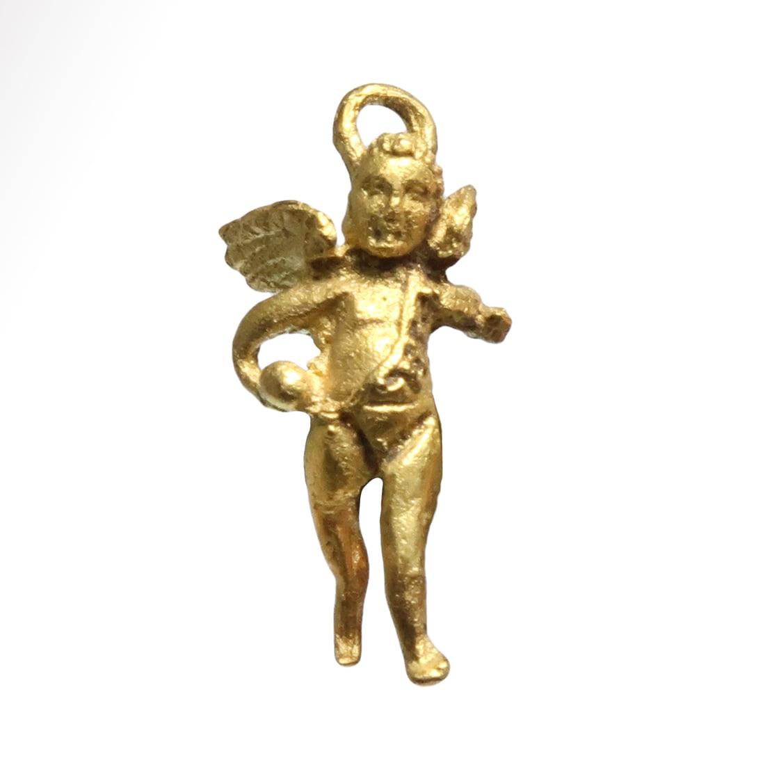 Roman Gold Pendant with Cupid / Eros, c. 1st Century A.D.: Roman Gold Pendant with Cupid / Eros, c. 1st Century A.D.Depicted nude save for a belt over his left shoulder, advancing, holding a ball in his right hand, spread wings and loop for suspension.Size:1.
