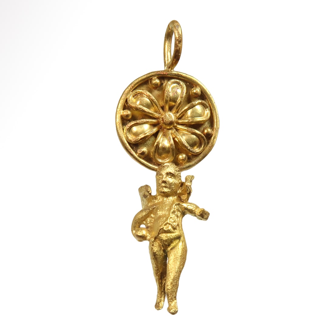 Roman Gold Pendant of Cupid / Eros with Daisy, c. 1st Century A.D.: Roman Gold Pendant of Cupid / Eros with Daisy, c. 1st Century A.D. Depicted nude save for a harness over his left shoulder, advancing, holding a ball in his right hand, attached to a shield shaped fro