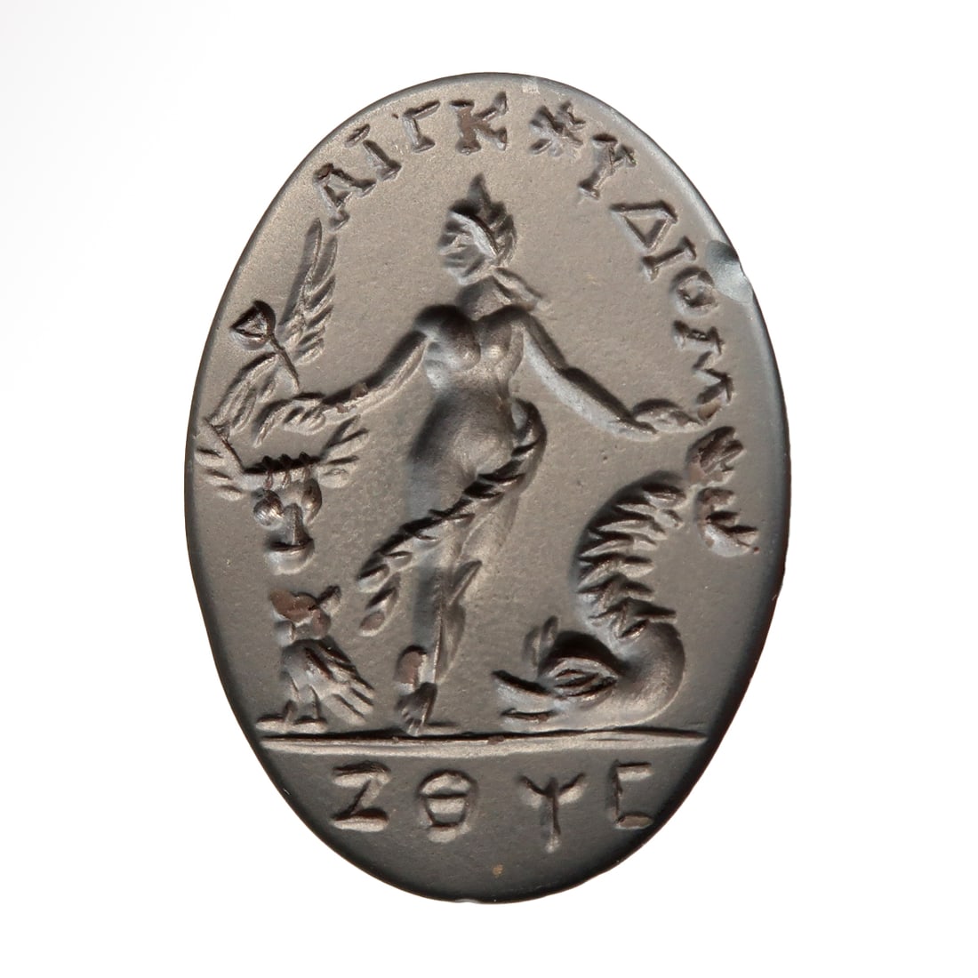 Egyptian Hematite Magical Gnostic Intaglio with Sophia, the Fallen Wisdom, Roman Period, c. 2nd-3rd: Egyptian Hematite Magical Gnostic Intaglio with Sophia, the Fallen Wisdom, Roman Period, c. 2nd-3rd Century A.D.Oval black hematite intaglio engraved with the figure of the nude fallen angel Sophia, t