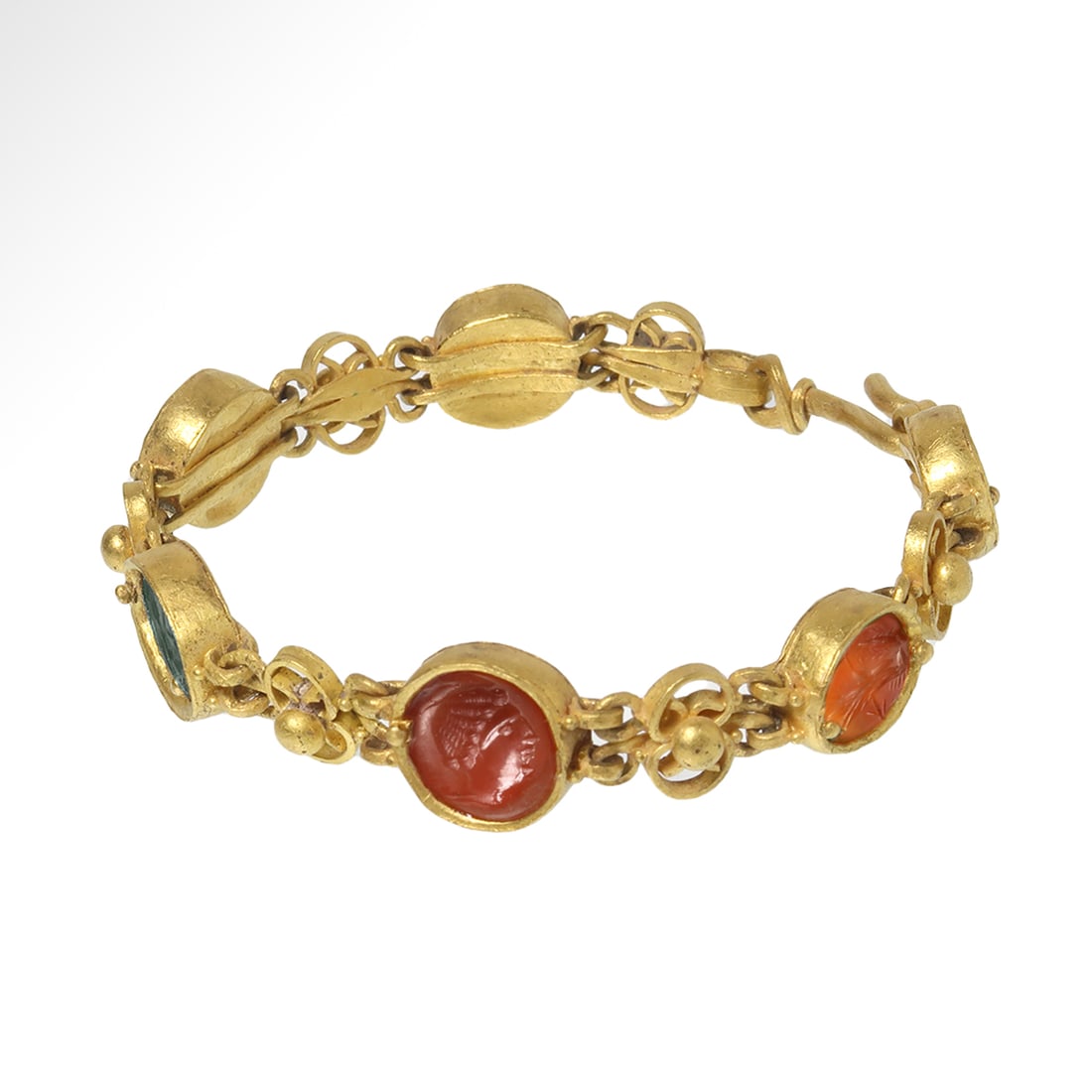 Gold Bracelet with Six Roman Intaglios (c.1st-2nd Century A.D.) set in Grand Tour (19th Century A.D): Gold Bracelet with Six Roman Intaglios set in Grand Tour (19th Century A.D. )Bracelet, c. 1st -2nd Century A.D.Six Roman intaglios in semi-precious stones, two carved with eagles (lapis lazuli and cor