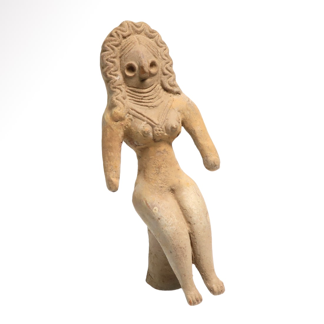 Indus Valley Terracotta Mother Goddess Idol, c. 2500 B.C.: Indus Valley Terracotta Mother Goddess Idol, c. 2500 B.C.Sitting nude on an integral stand, hands straight, ample breasts, bird-like face, nice details of the hair and typical scarf headdress, star sh