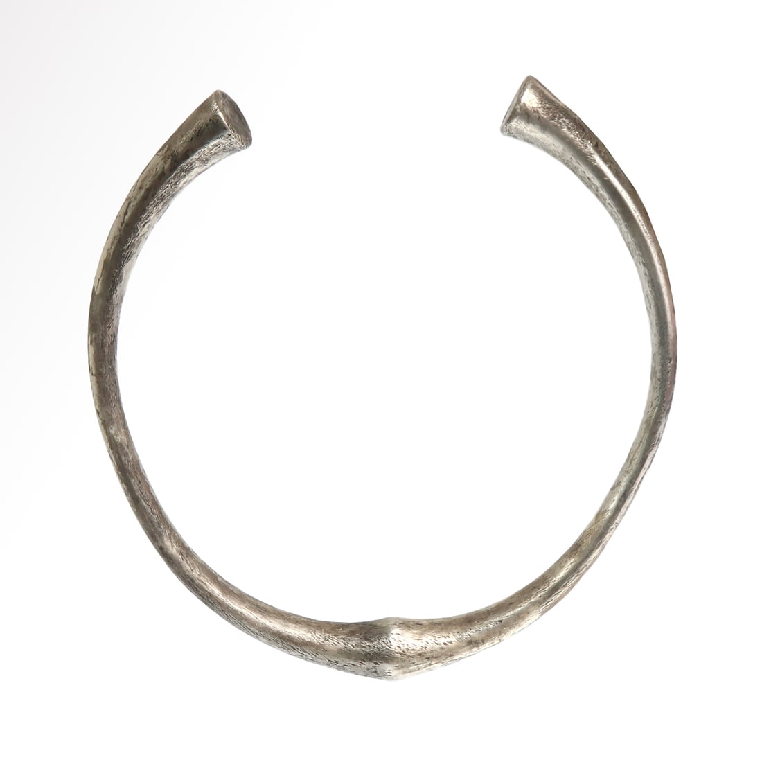 Greek Solid Silver Bracelet, c. 5th-3rd Century B.C.: Greek Solid Silver Bracelet, c. 5th-3rd Century B.C.Solid silver hoop of round section, widening at the centre and the terminals in a trumpet shape. Very popular style in the mid 1st Millennium B.C.Si