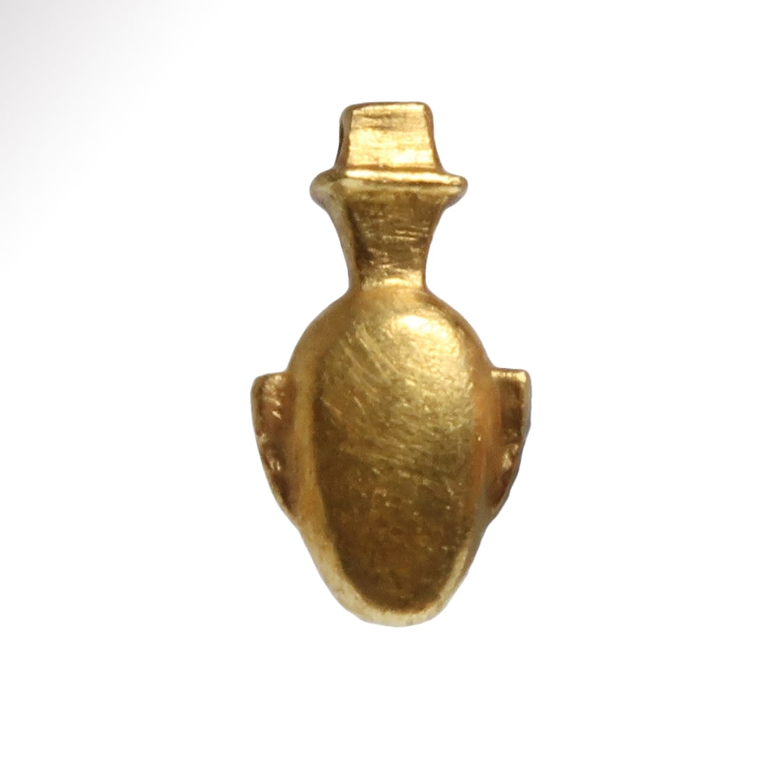 Egyptian Solid Gold Heart Amulet, New Kingdom, c. 1550-1070 B.C.: Egyptian Solid Gold Heart Amulet, New Kingdom, c. 1550-1070 B.C.Solid gold amulet in the form of a heart. Loop at the top for suspension. Size:1.5 cm L (including loop) - 9/16 inch Material:Gold, 2.8