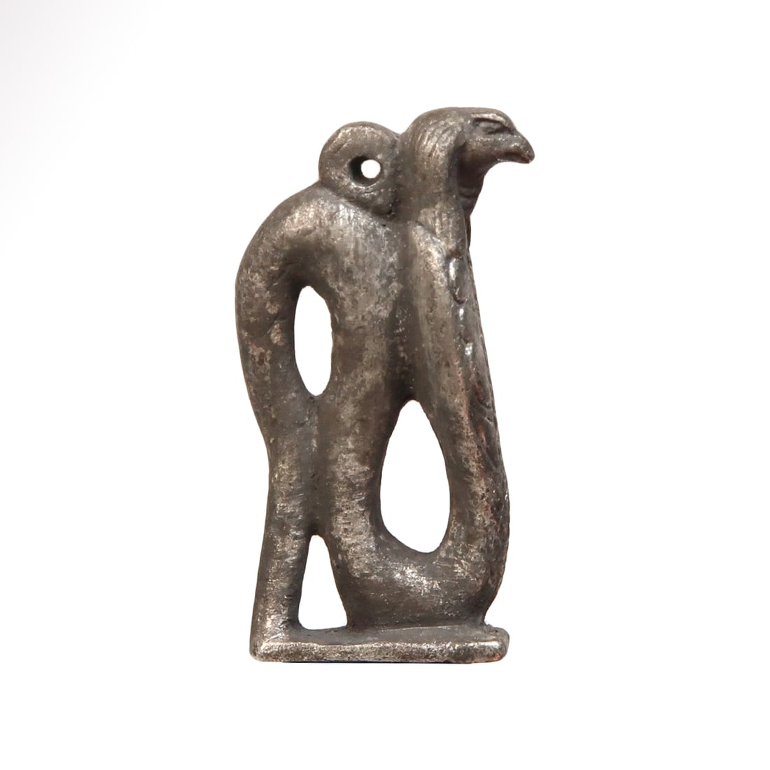 Egyptian Silver Uraeus Rare Amulet with Head of Horus, c. 600 B.C.: Egyptian Silver Uraeus Rare Amulet with Head of Horus, c. 600 B.C.Solid silver cast with a Uraeus cobra with the head of Horus, very fine carved details, a loop at the top for suspension. On integral