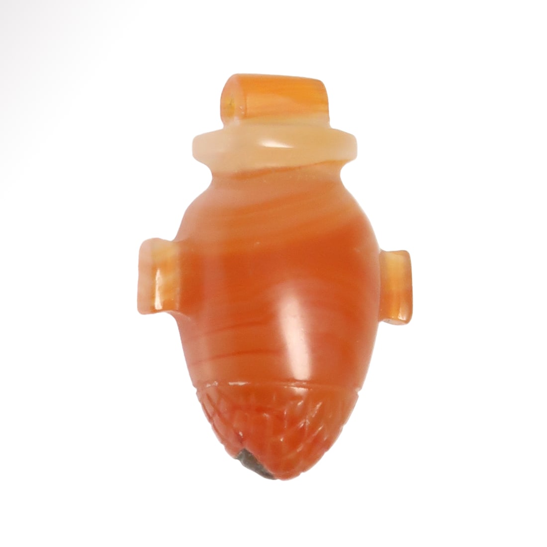 Egyptian Agate Heart Amulet, New Kingdom, c. 1550-1070 B.C.: Egyptian Agate Heart Amulet, New Kingdom, c. 1550-1070 B.C.Amulet in the form of a heart, in nice orange striped agate with incised net pattern to the lower section. Wide suspension loop.Size:2.4 cm L