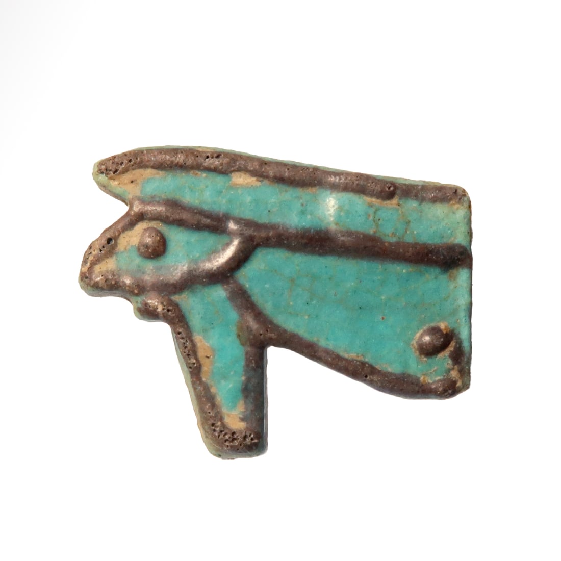 Egyptian Bichrome Eye Amulet, c. 600 B.C.: Egyptian Bichrome Eye Amulet, c. 600 B.C.Turquoise faience, both sides details highlighted in black glaze. Exquisite.Size:2.8 cm L - 1 1/8 inch Material:Faience Culture:Egypt, c. 600 B.C.Prove