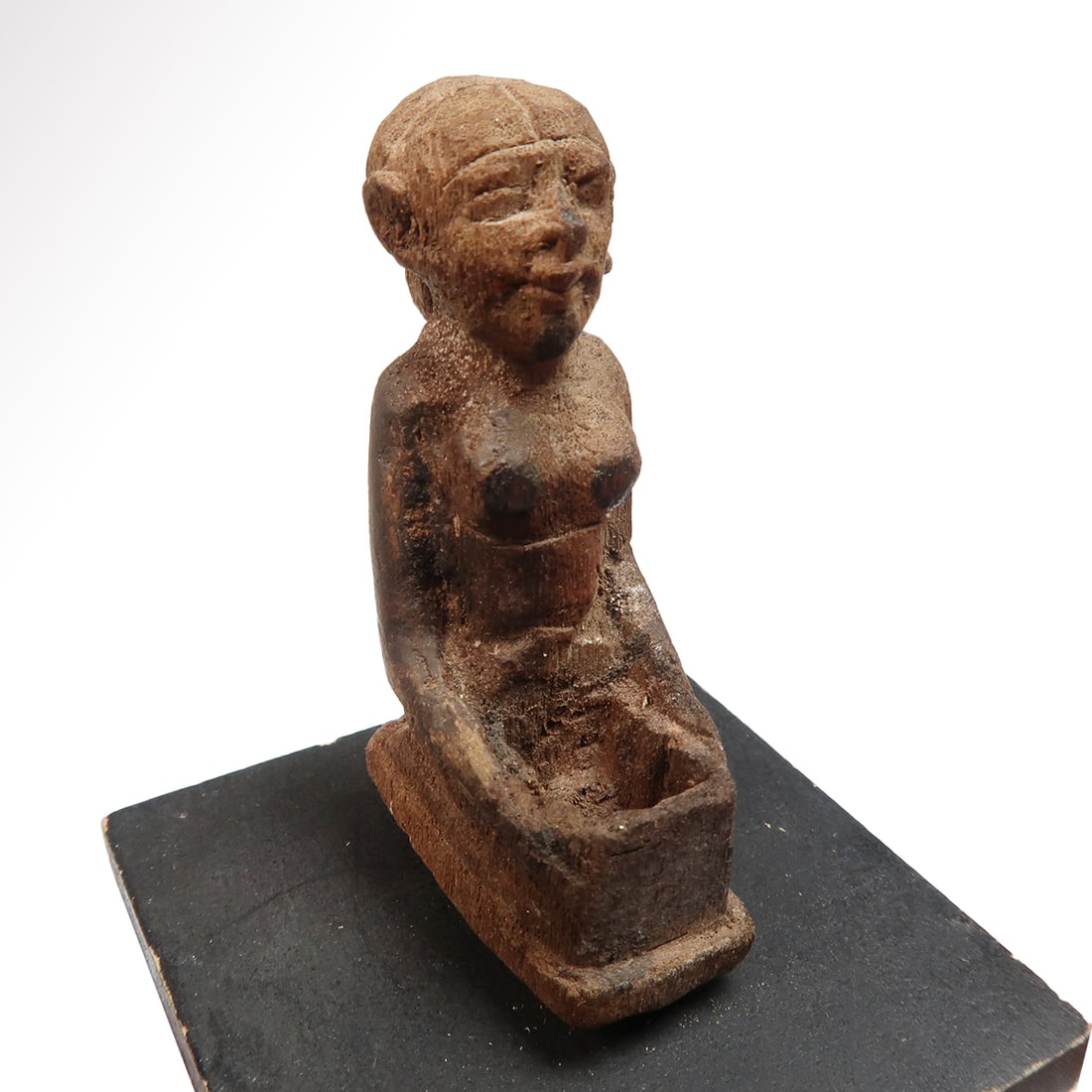 Egyptian Wood Kneeling Offering Figure, Middle Kingdom, c. 1800 B.C.: Egyptian Wood Kneeling Offering Figure, Middle Kingdom, c. 1800 B.C.Finely modelled small figure of a female, kneeling naked, arms holding a bowl on her legs, wearing tight-fitting cap and with nice f