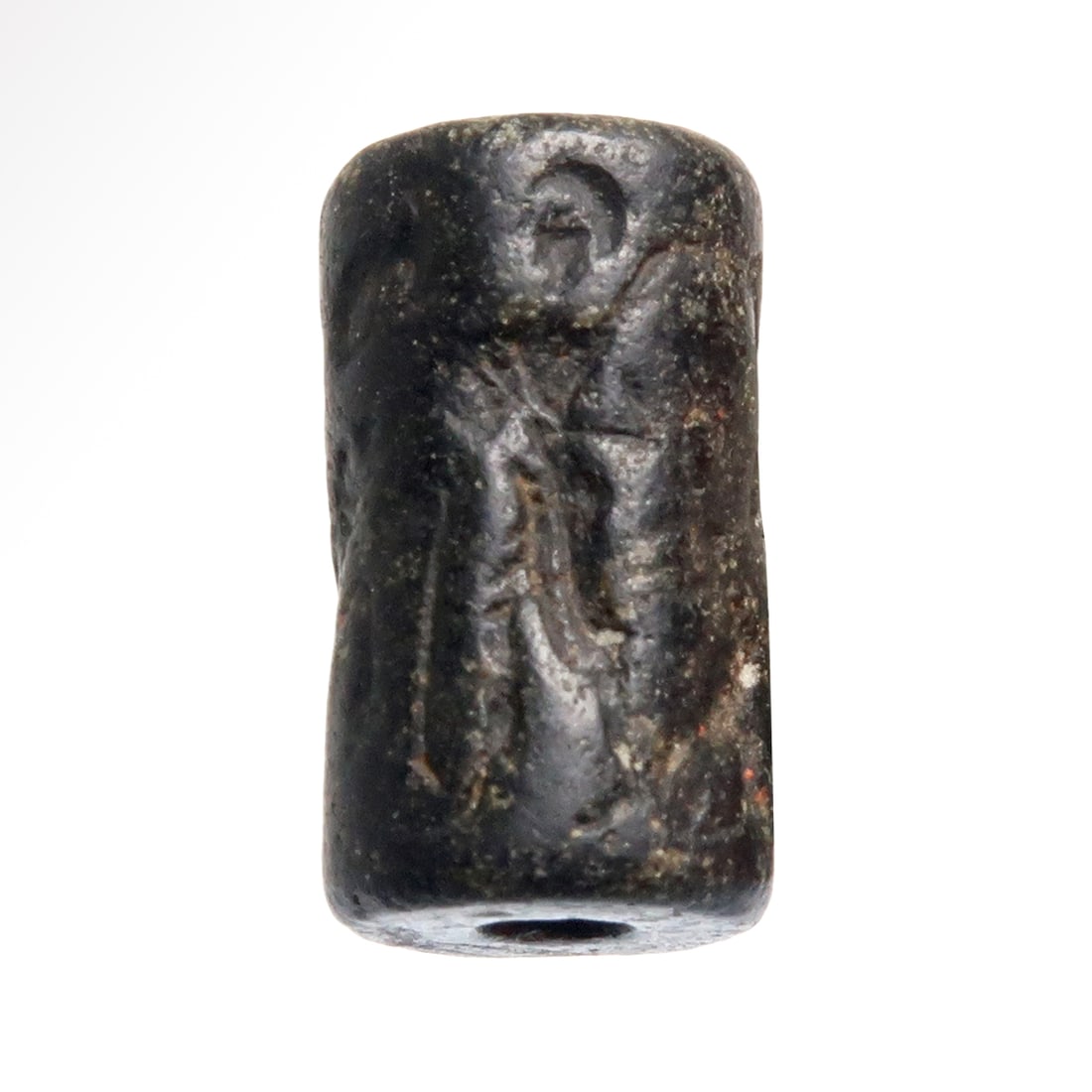 Old Babylonian Hematite Cylinder Seal with God Lugal, c. 1700 B.C.: Old Babylonian Hematite Cylinder Seal with God Lugal, c. 1700 B.C.Advancing Lugal with sword over his shoulder and a stag behind, a figure with lion beside and an advancing deity.Size:1.6 cm L - 5/8 i