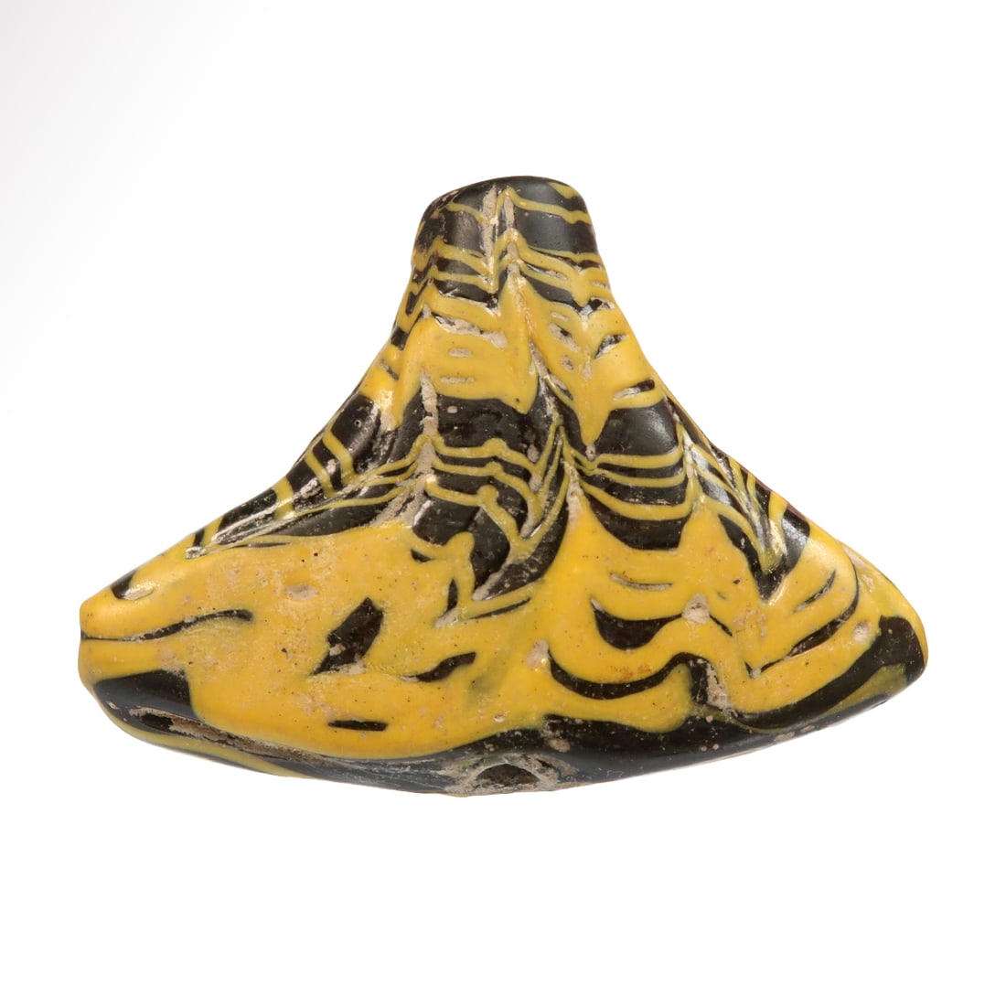 Very Large Roman Glass Central Mosaic Bead, c. 3rd Century A.D.: Very Large Roman Glass Central Mosaic Bead, c. 3rd Century A.D.Fan shaped with applied yellow combed trailing. Pierced vertically for suspension.Size:6 cm L (base) - 2 3/8 inches Material:Glass Cultur