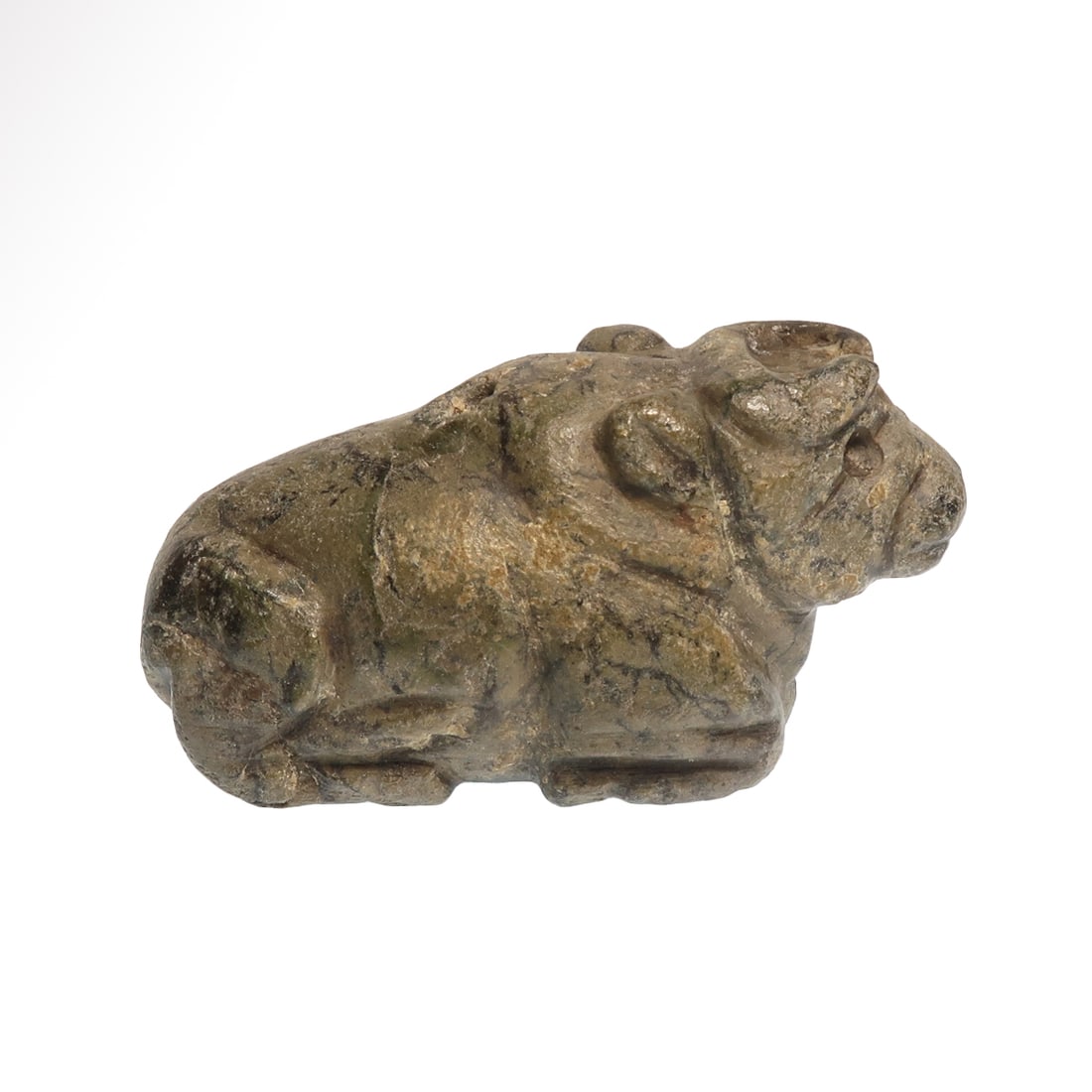 Large Sumerian Serpentine Bull Amulet, c. 2200 B.C.: Large Sumerian Serpentine Bull Amulet, c. 2200 B.C.Crouching bull, head facing forwards, legs tucked under the body, tail curving and resting on its back. Drilled vertical hole.Size:7.1 cm L - 2 13/16