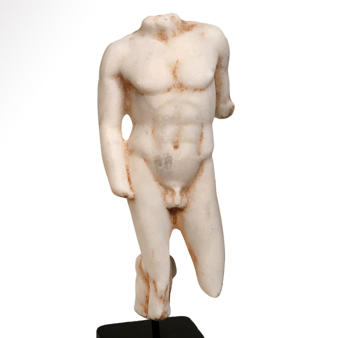 Roman Marble Figure of a Young Apollo, c. 1st-2nd Century A.D.: Roman Marble Figure of a Young Apollo, c. 1st-2nd Century A.D.The young god standing with his weight on the right leg with both arms lowered, the right arm resting on his upper leg. Remains of a rock