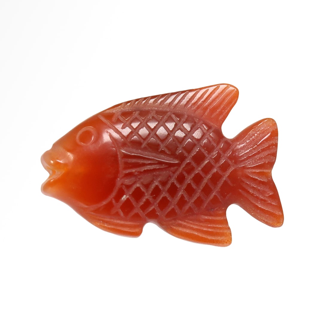 Egyptian Cornelian Fish Amulet/Bead, New Kingdom, c. 1550-1070 B.C.: Egyptian Cornelian Fish Amulet/Bead, New Kingdom, c. 1550-1070 B.C.Cornelian bead finely carved in the shape of a fish, loop for suspension. Exquisite details.Size:2.6 cm L - 1 1/16 inch Material:Corn