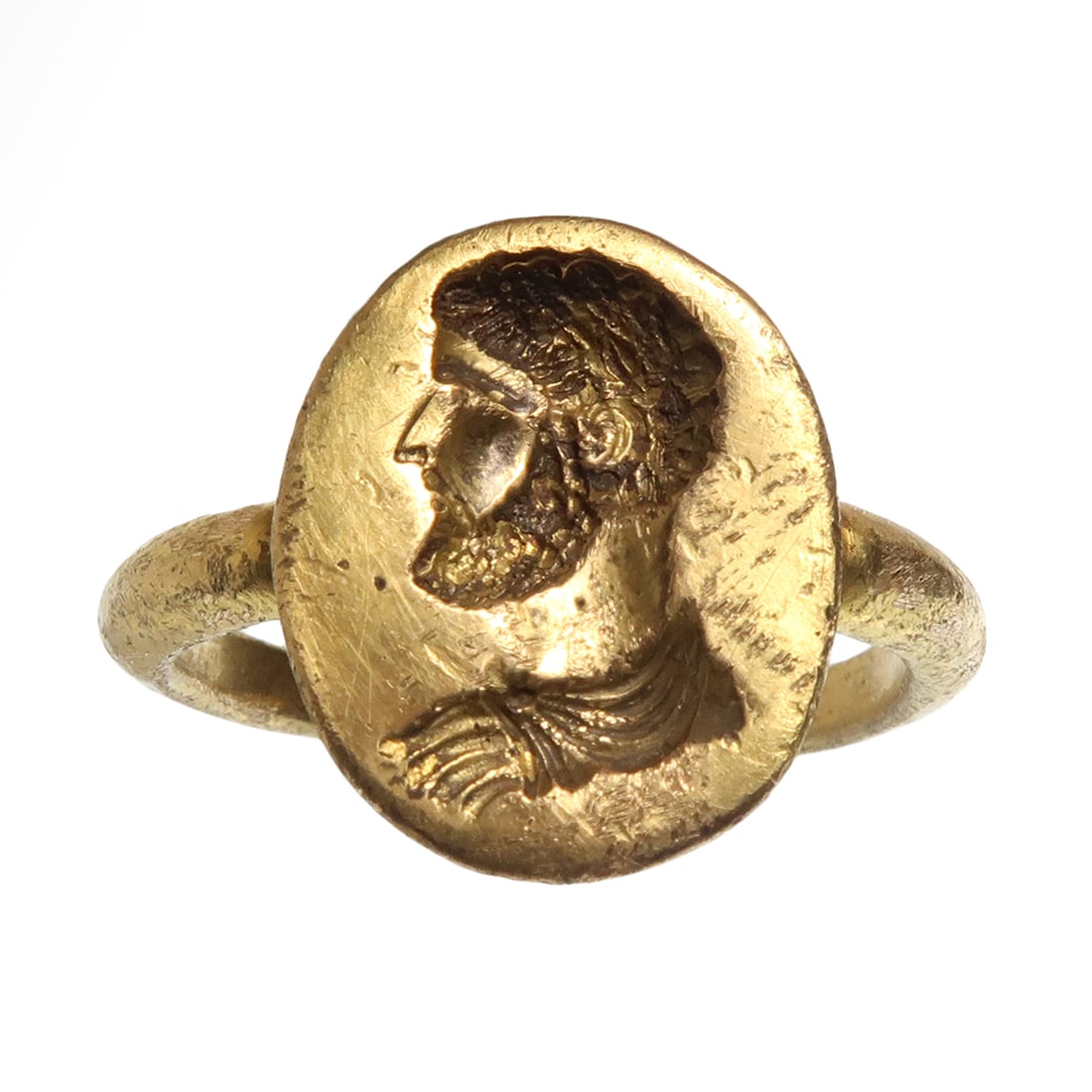 Roman Solid Gold Ring, Head of an Emperor, c. 2nd-3rd Century A.D.: Roman Solid Gold Ring, Head of an Emperor, c. 2nd-3rd Century A.D.Of solid gold, deeply carved with the profile bust head of probably Septimus Severus with curly hair and beard.Size:USA= 8 1/2 - GB= Q