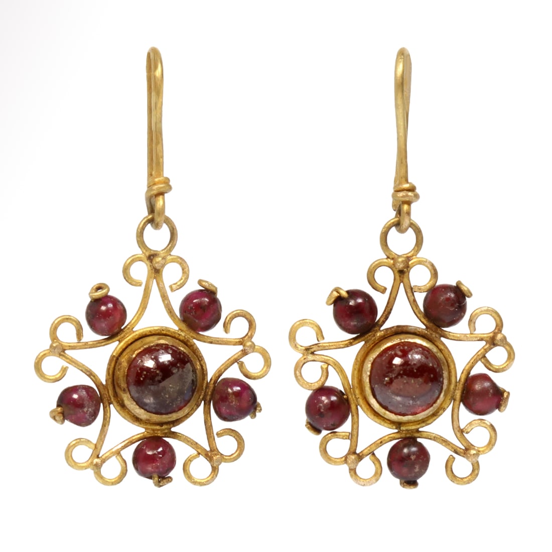 Roman Open-Work Gold and Garnet Star Shaped Earrings, c. 1st-2nd Century A.D.: Roman Open-Work Gold and Garnet Star Shaped Earrings, c. 1st-2nd Century A.D. Star shaped bezel finely worked in filigree set with a central garnet and surmounted by five garnet round beads, integral 