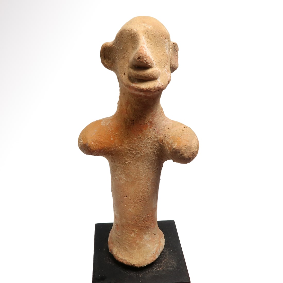 Canaanite Terracotta Votive Columnar Figure, c. 2nd Millennium B.C.: Canaanite Terracotta Votive Columnar Figure, c. 2nd Millennium B.C. Columnar type with pronounced moulded facial features, arms stretched out. Size:12 cm H - 4 11/16 inches Material:Terracotta Culture
