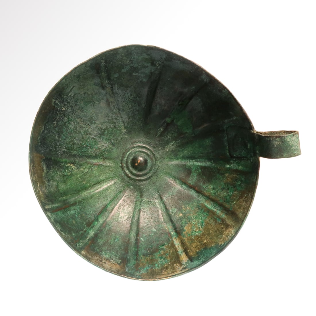 European Hallstatt Bronze Age Military Bronze Bowl, c. 1000 -800 B.C.: European Hallstatt Bronze Age Military Bronze Bowl, c. 1000 -800 B.C. Ribbed body, central concentric pattern, loop handle. Lustre patina. Size:Bowl 12 cm D - 4 3/4 inches -- Including handle: 13.4 cm