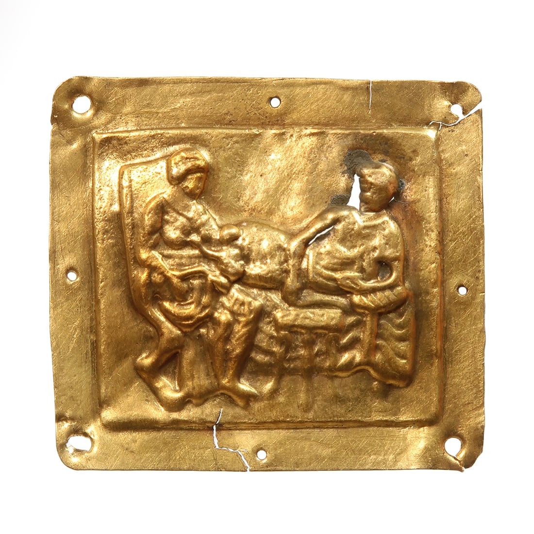 Roman Gold Sheet Plaque with Nursing Scene, c. 5th-4th Century B.C.: Roman Gold Sheet Plaque with Nursing Scene, c. 5th-4th Century B.C. Gold sheet worked in repousse with a woman suckling a child, finely detailed body, a man resting on a bed, a table between them. Hol