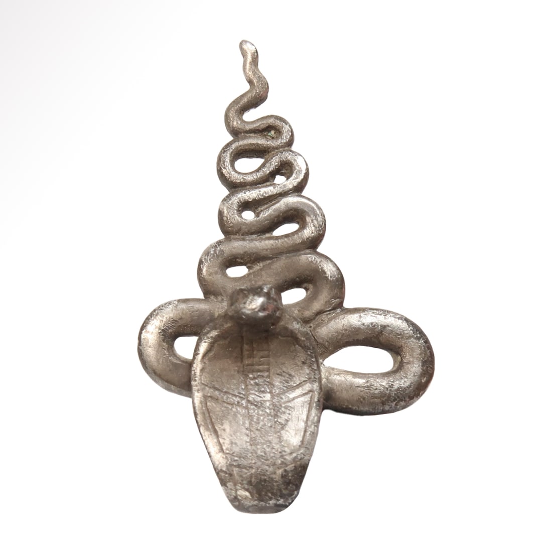 Egyptian Silver Uraeus Amulet, c. 600 B.C.: Egyptian Silver Uraeus Amulet, c. 600 B.C. Coiled, with finely incised frontal details and decorations, wide ridged loop at the back for attachment. Exquisite. Size:3.1 cm L - 1 1/4 inch Material:Silv