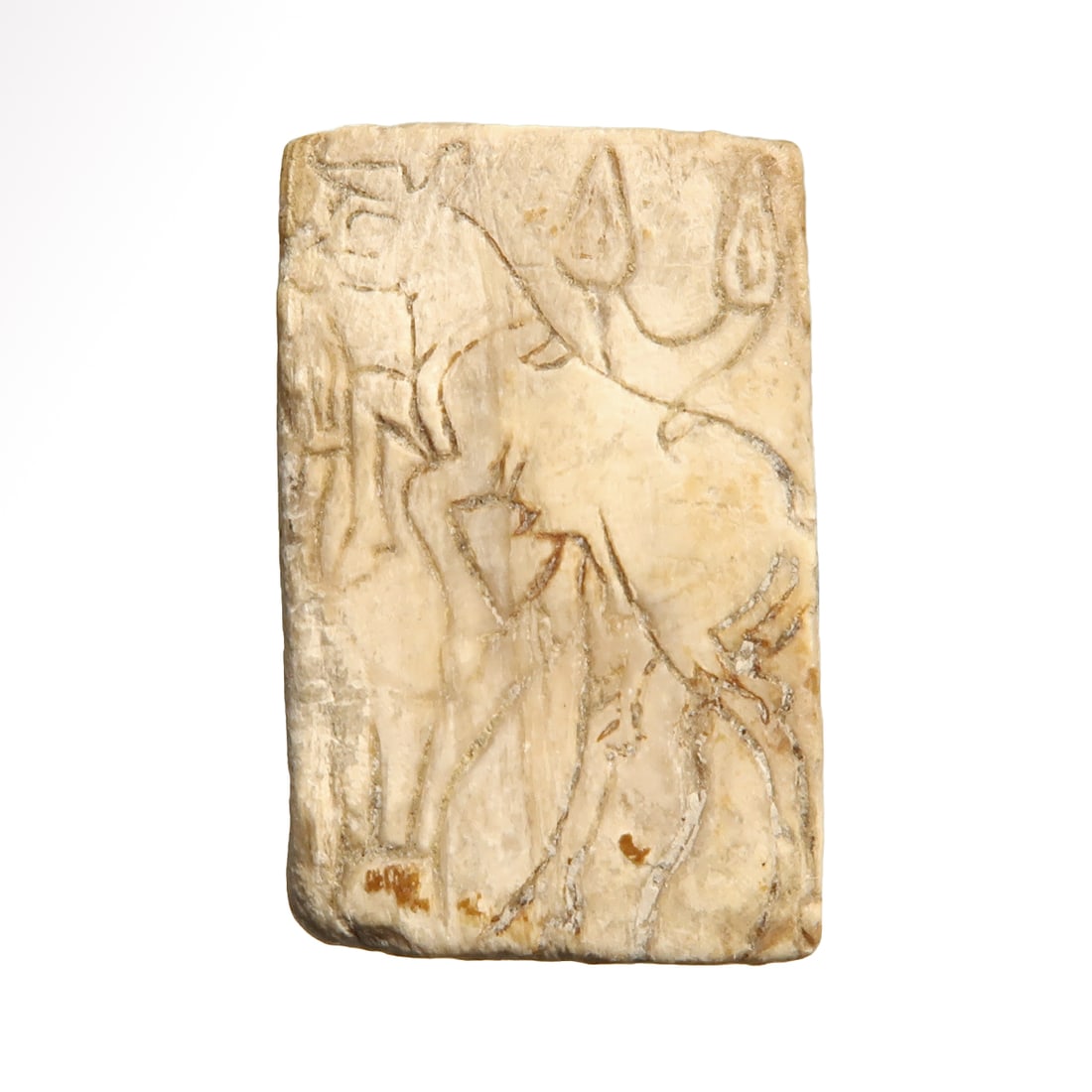 Sumerian Mother-of-Pearl Inlay Plaque with Bull, c. 2500 B.C.: Sumerian Mother-of-Pearl Inlay Plaque with Bull, c. 2500 B.C. Engraved with a standing bull and lotus buds. Size:2.5 cm L - 1 inch Material:Mother of pearl Culture:Sumerian, c. 2500 B.C. Provena