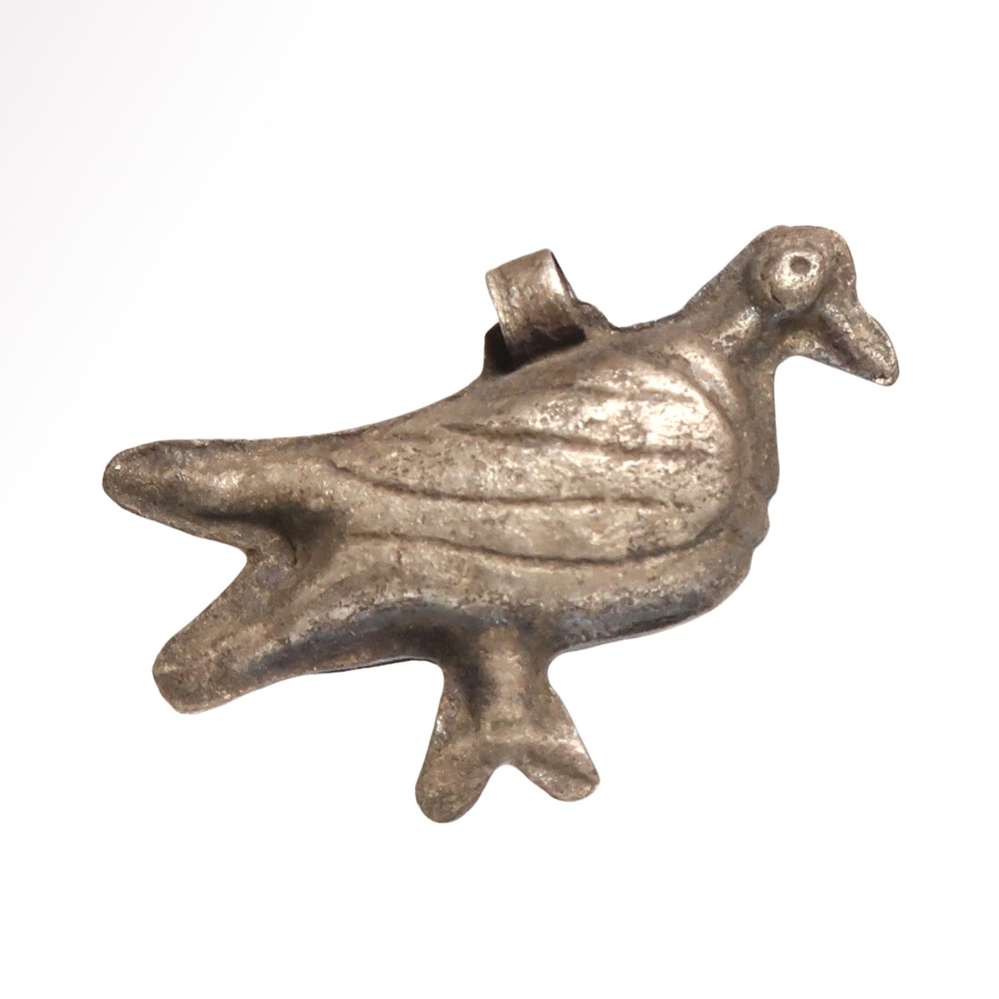 Roman Hollow Silver Amulet of a Dove, c. 1st Century A.D.: Roman Hollow Silver Amulet of a Dove, c. 1st Century A.D. Hollow silver amulet in repoussé work on the two sides in the shape of a standing dove with finely engraved details of the wings and eyes. Su