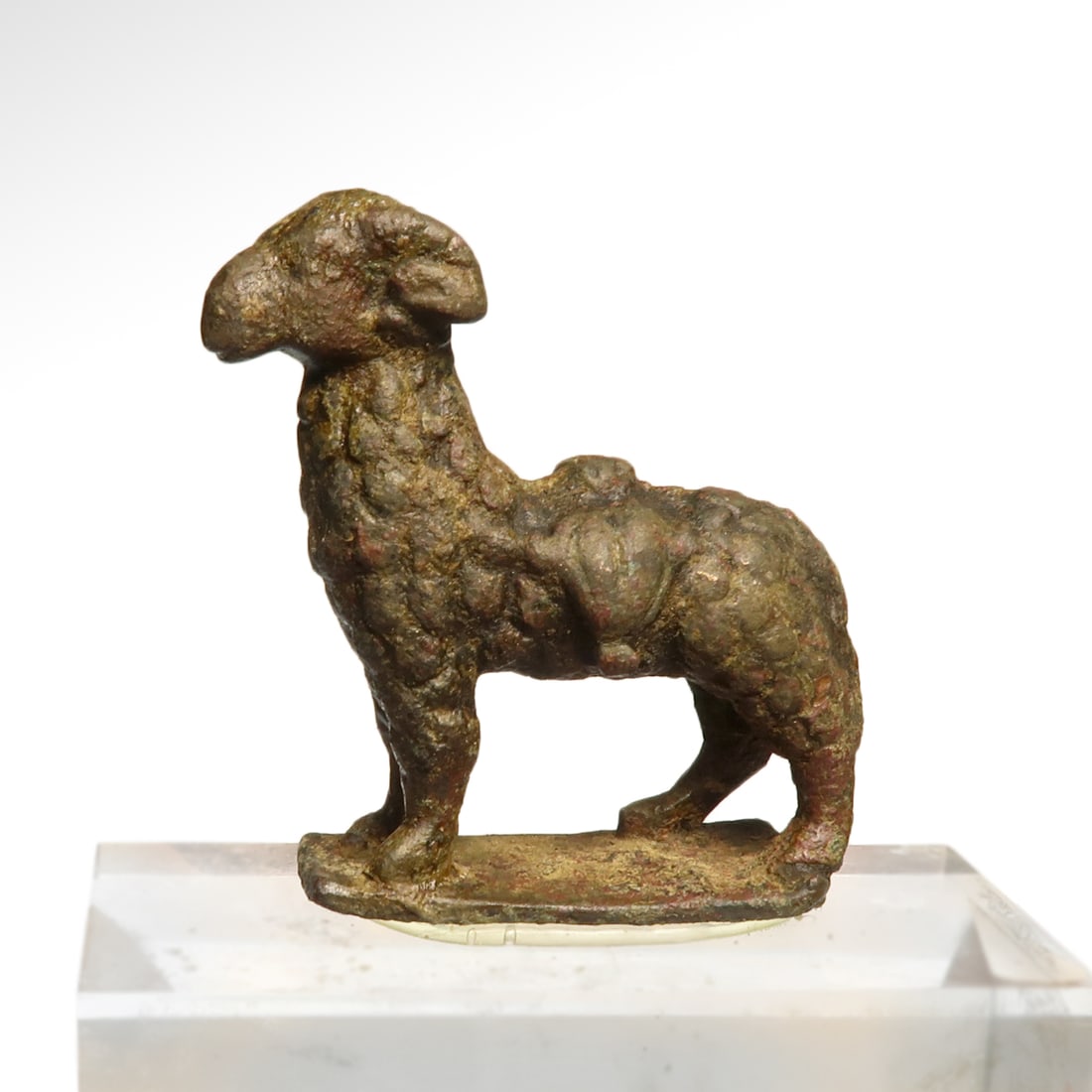 Roman Bronze Sheep, c. 4th-5th Century A.D.: Roman Bronze Sheep, c. 4th-5th Century A.D. On an integral stand, with curly wool, detailed body, head and face. In Christianity, the sheep represents the followers of Christ. Size:5 cm L - 1 15/16 in