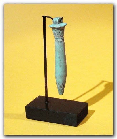 Egyptian Blue Faience Amulet of a Papyrus Sceptre: Egyptian Blue Faience Amulet of a Papyrus Sceptre With Lotus Flower, c. 600 B.C. Turquoise faience, covered with patination in areas, loop at the top for suspension. Rare, with the lotus design deeply