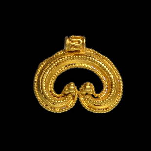 Viking Gold Filigree Scroll Pendant: Viking Gold Filigree Scroll Pendant, c. 9th - 11th Century A.D.A D-section gold crescent pendant with beaded wire borders and applied band, integral loop with filigree, granule clusters to the finials