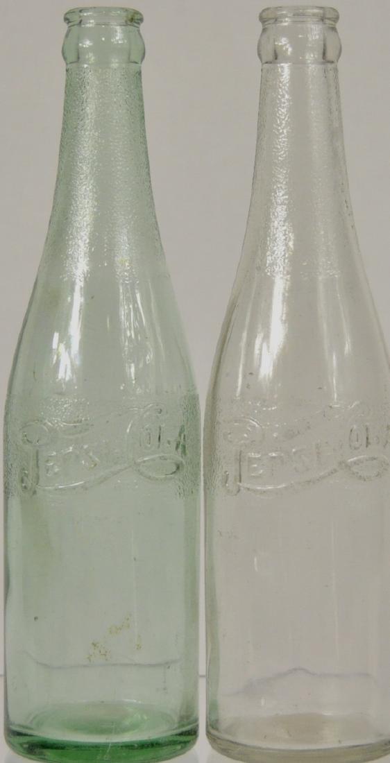 2) Laurens Glass Works Pepsi Cola Bottles: 1) Colorless, double dot script logo on shoulder, 9.75 in., 1) aqua, double dot script logo on shoulder, 9.75 in., both have very minor case wear.