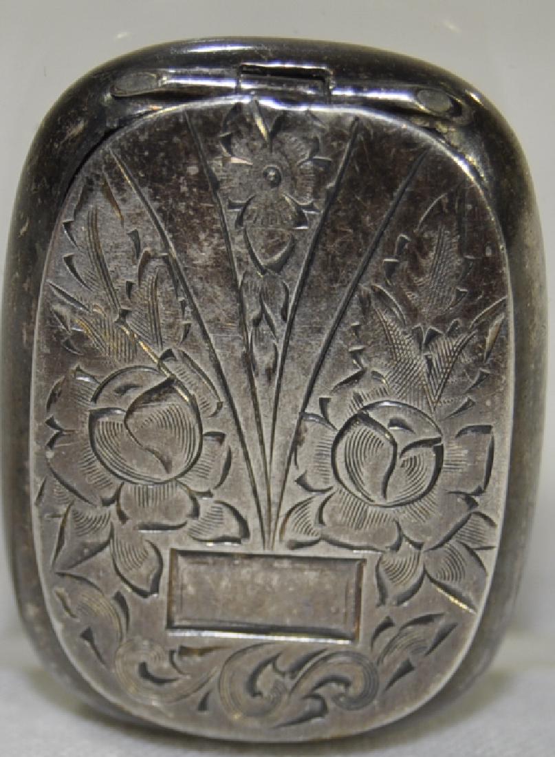 Sterling Pill Box: B. B. Co. Hand chased lid, cartouche is not monogrammed, 1.25 in. x 1 in. x 0.25 in.