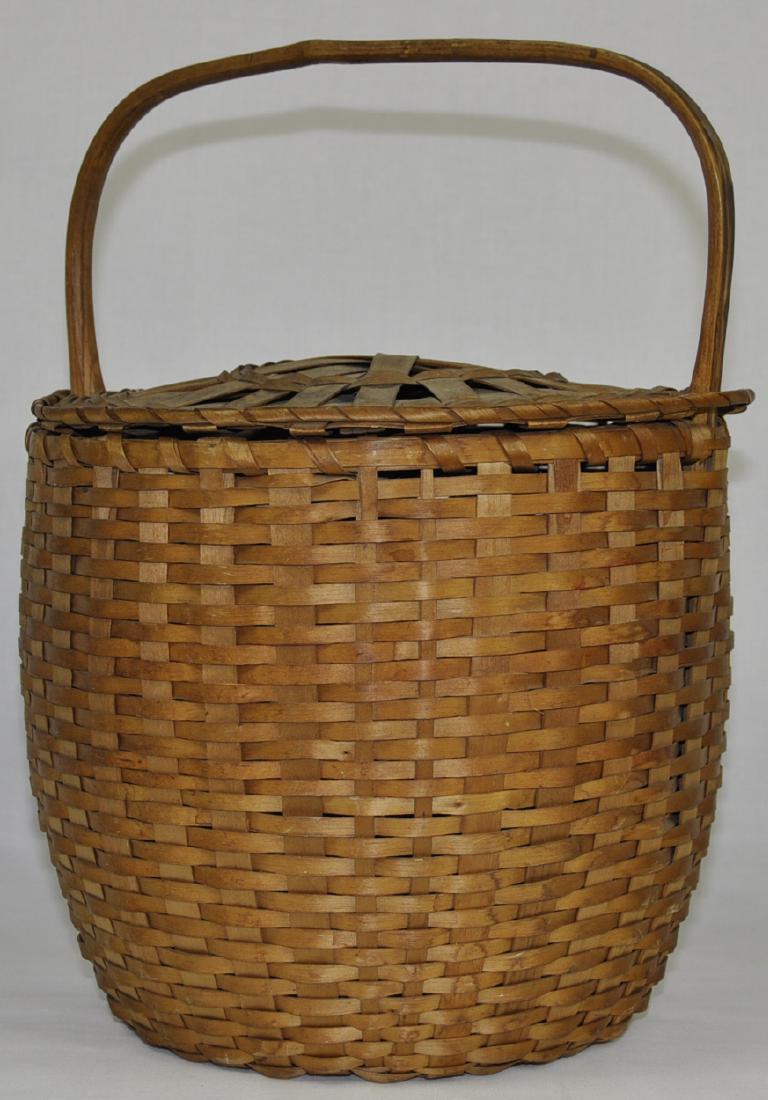 Native American Antique Splint Feather Basket: Northern New York, Canada, very good condition with intact cover, partial label visible on carved bentwood handle, 15 in. x 13 in.