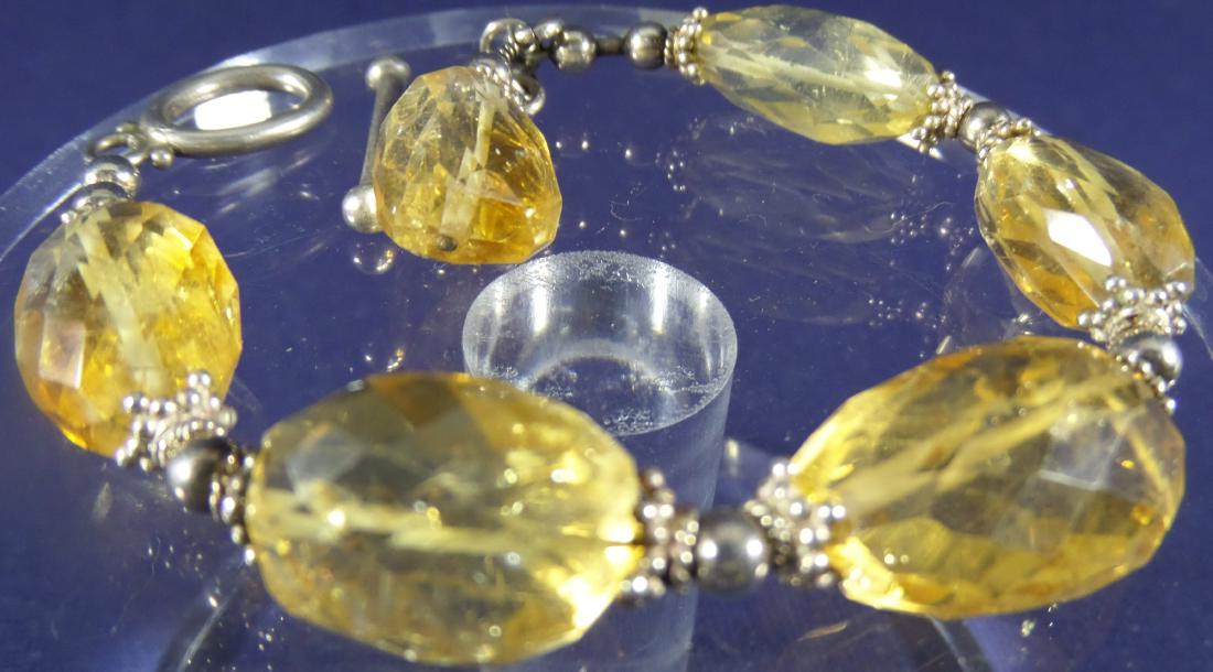 Yellow Citrine Bracelet: Asymmetrical, faceted beads, silver-tone toggle, 7 in.