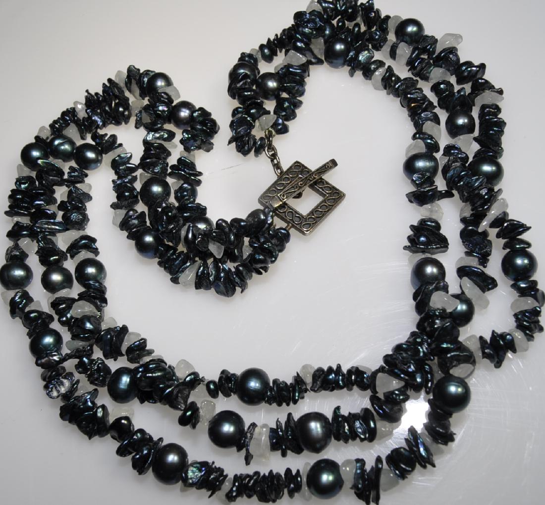 Tahitian Pearl & Dyed Abalone Necklace: 16 in. triple strand of approximately 8mm Tahitian baroque pearls and abalone beads spaced with quartz. Darkened silver-tone toggle clasp.