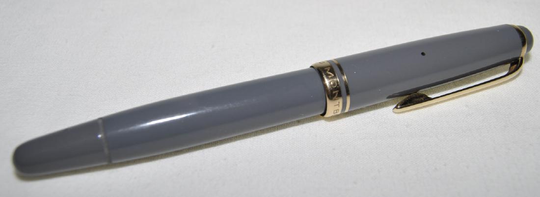 Montblanc 1252 Grey Resin Fountain Pen: Screw cap with snow cap insignia, piston-fill, clear ink resevoir, stamped Made In Germany along the barrel, also stamped F- on the turn knob. Measuring 5 in. capped, there are traces of ink in the re